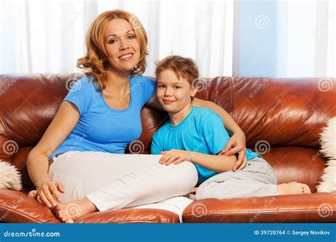 mom and son facesitting|Mother and Son Sitting on the Couch .